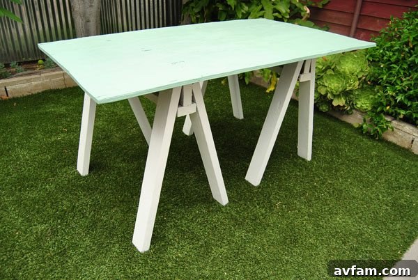 Custom-built painted sawhorse table outdoors
