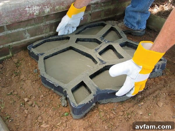 Image demonstrating the immediate removal of the Quikrete Walk Maker mold after concrete filling