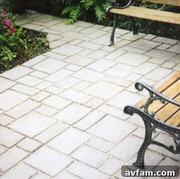 An elegant Quikrete Walk Maker pathway showcasing the European Block pattern, ideal for a more formal landscape design
