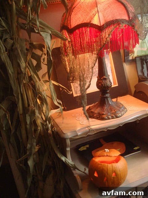 A dimly lit interior view, emphasizing the play of light and shadow on various Halloween decorations, creating a genuinely spooky ambiance.