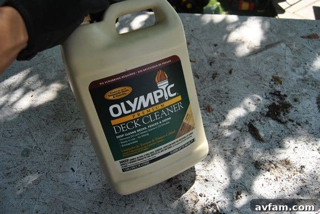 Olympic Premium Deck Cleaner being used for thorough surface preparation before resurfacing