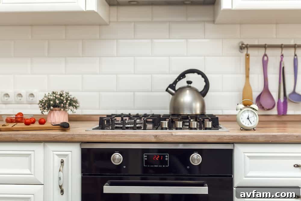 Modern kitchen with a black cooktop and built-in oven