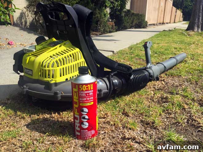 Switching to TRUFUEL for Blower Maintenance A person pouring TRUFUEL from a can into the fuel tank of a red backpack leaf blower, highlighting the ease of use and direct application of the premixed fuel.