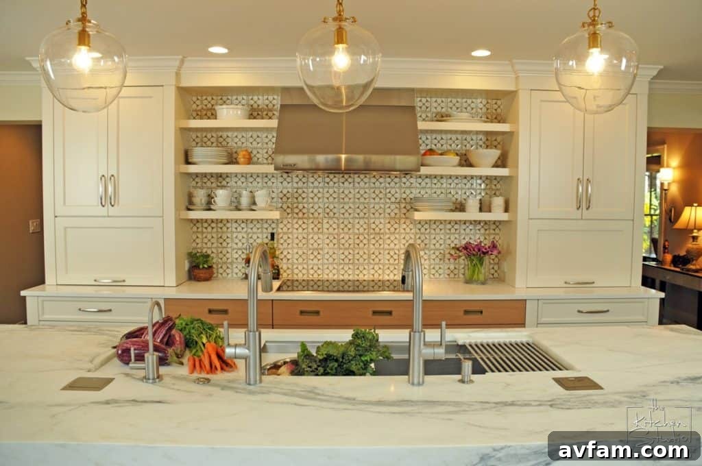 Luxurious white kitchen with custom island