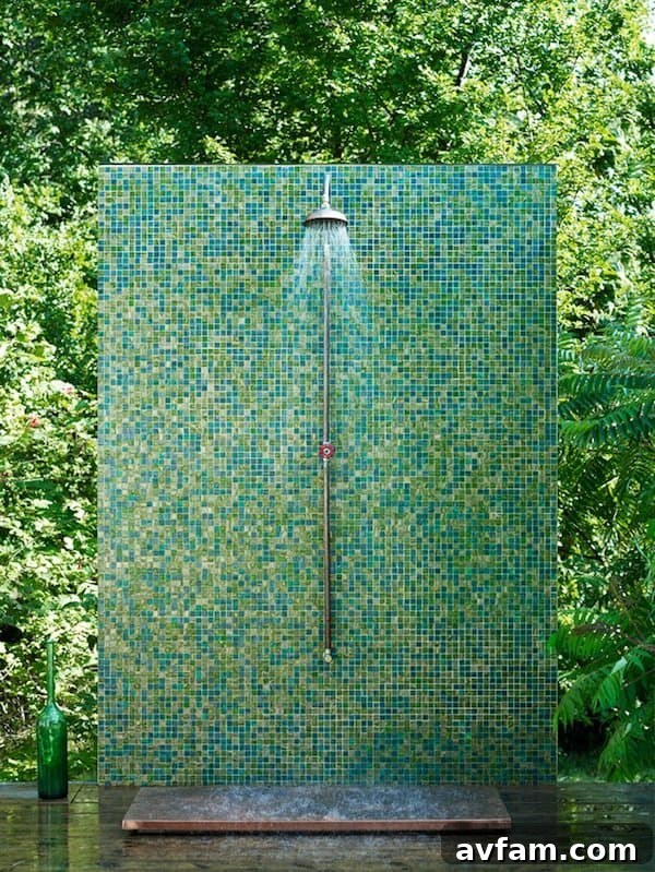 Outdoor shower with wooden slatted walls and natural rock base