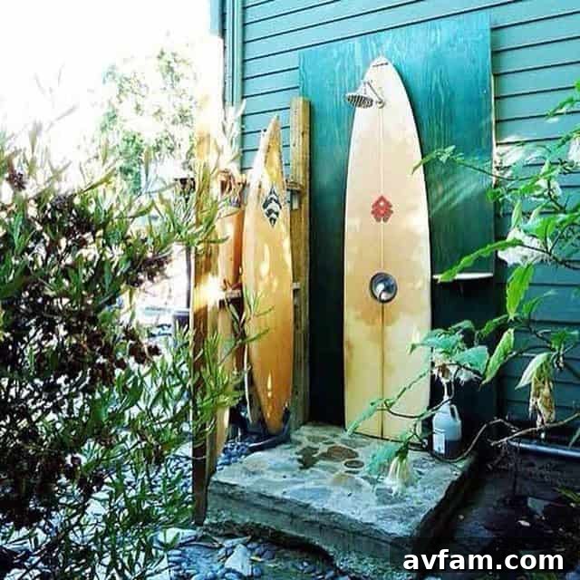 Rustic outdoor shower with exposed pipe and simple wood backdrop