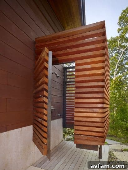 Simple wall-mounted outdoor shower with concrete wall
