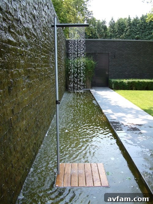 Contemporary outdoor shower with stone and wood accents