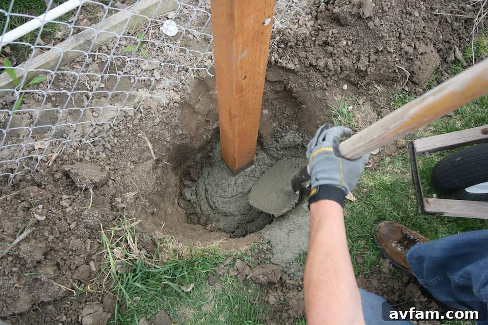 Setting a fence post securely below the frost line prevents movement