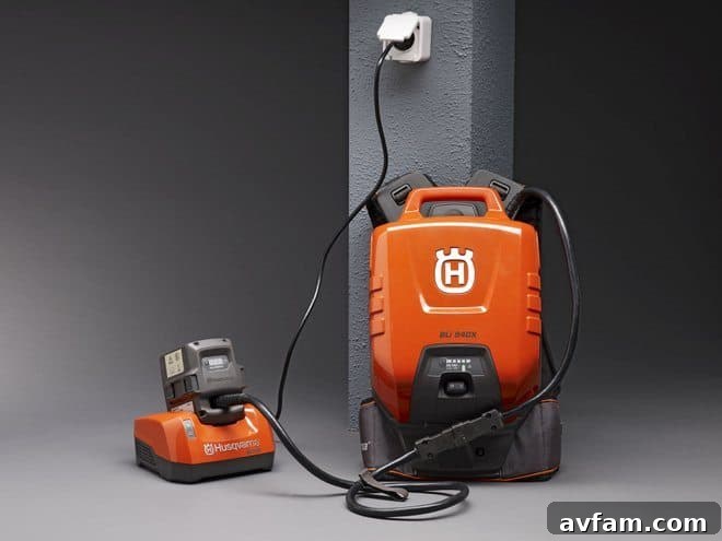 Husqvarna battery-powered hedge trimmer in use
