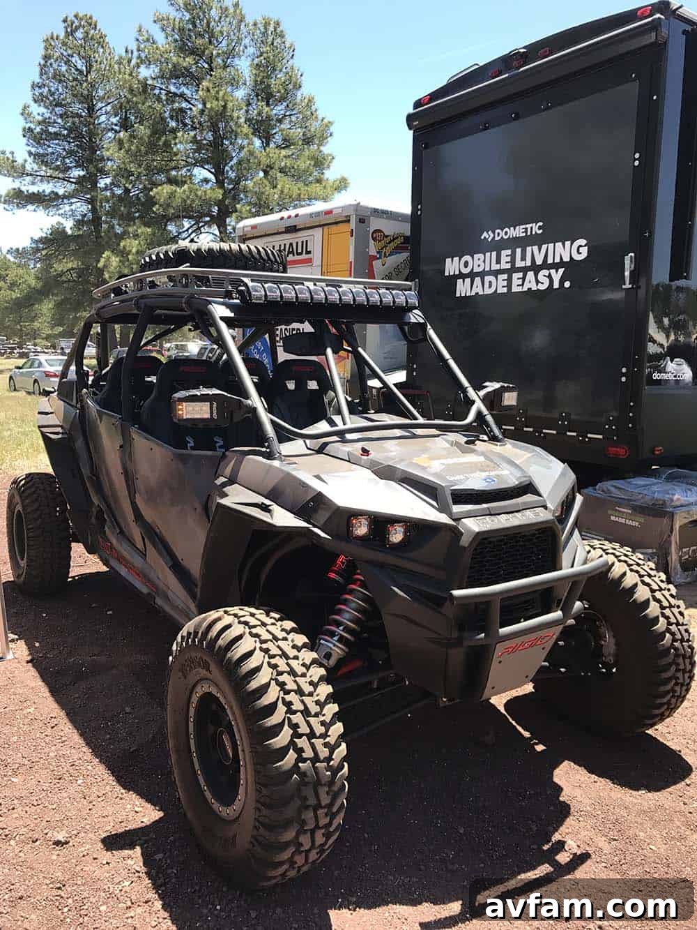 A well-organized cargo area of an overland vehicle, showing storage solutions for recovery gear and tools.