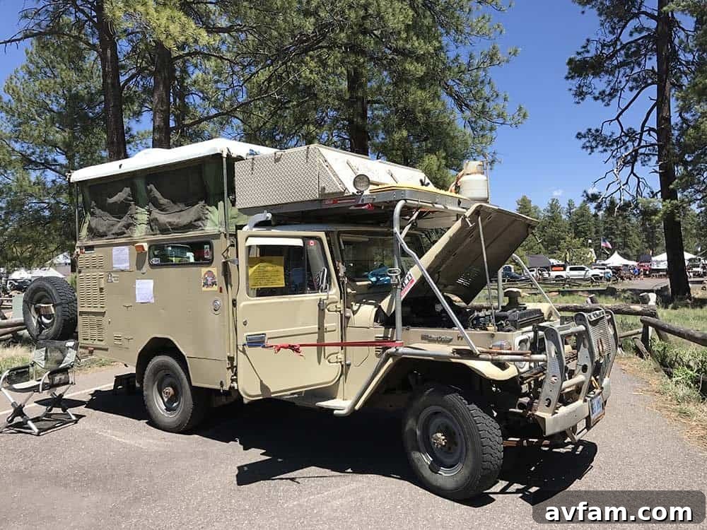 A group of overland vehicles, including a Subaru Outback, parked together at the expo, highlighting various setups.