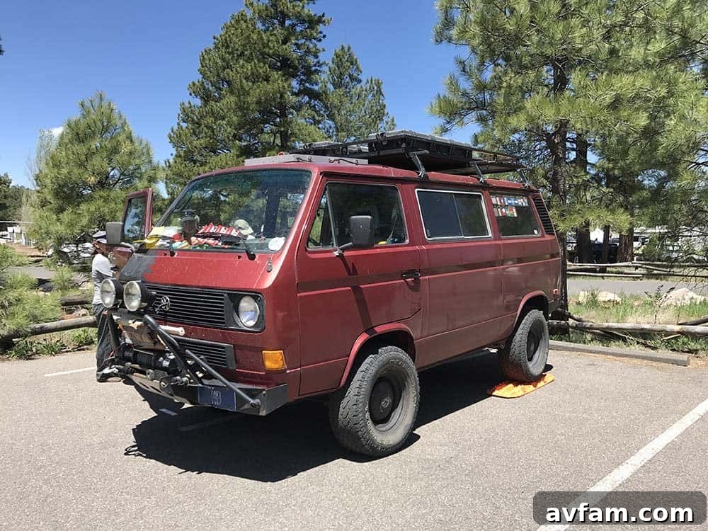 An impressive custom-built overland rig with a pop-top camper, designed for extreme durability and off-road capability.