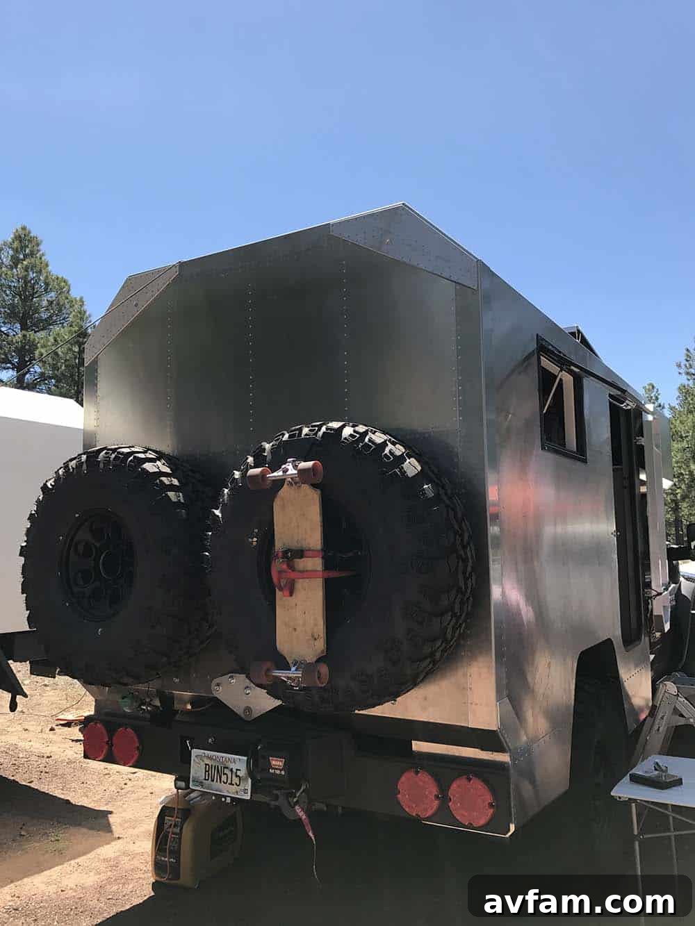 A vibrant orange Toyota Land Cruiser FJ40, a classic icon of off-road adventure, at Overland Expo.