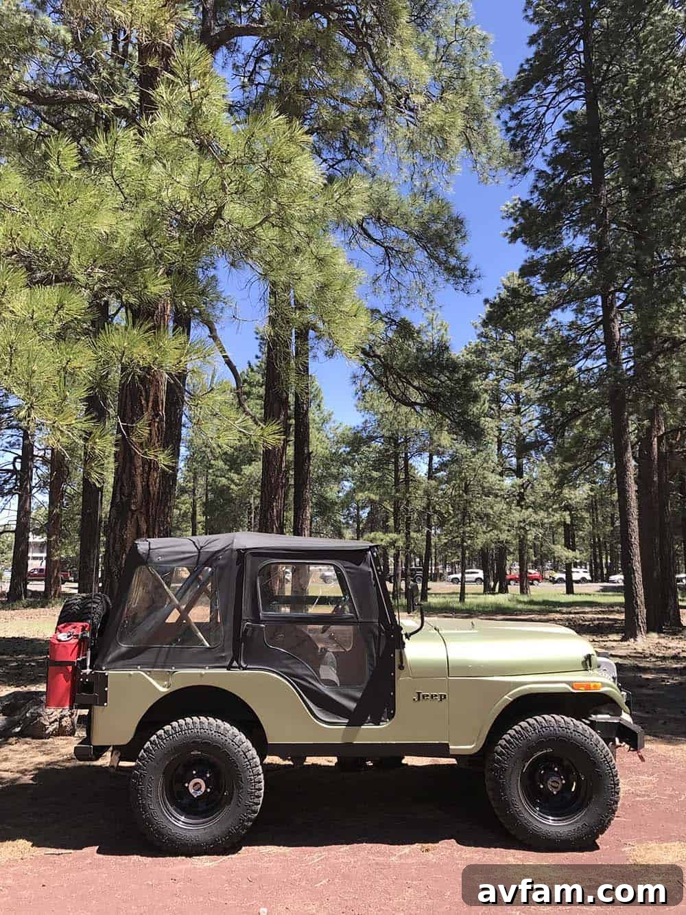 A black Toyota Tundra pickup truck with an integrated camper, designed for serious long-distance overland travel.