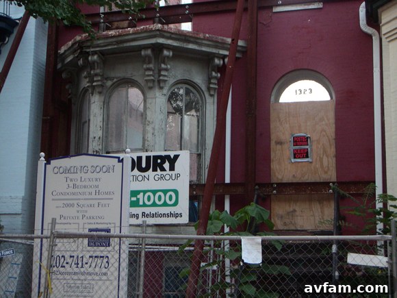 A person meticulously renovating a home, symbolizing the intersection of DIY and urban revitalization.