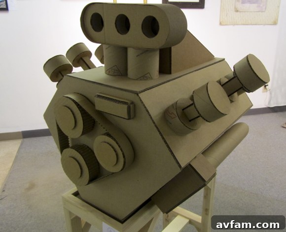 Intricate replica engine sculpture crafted entirely from cardboard at the Columbus Idea Foundry.