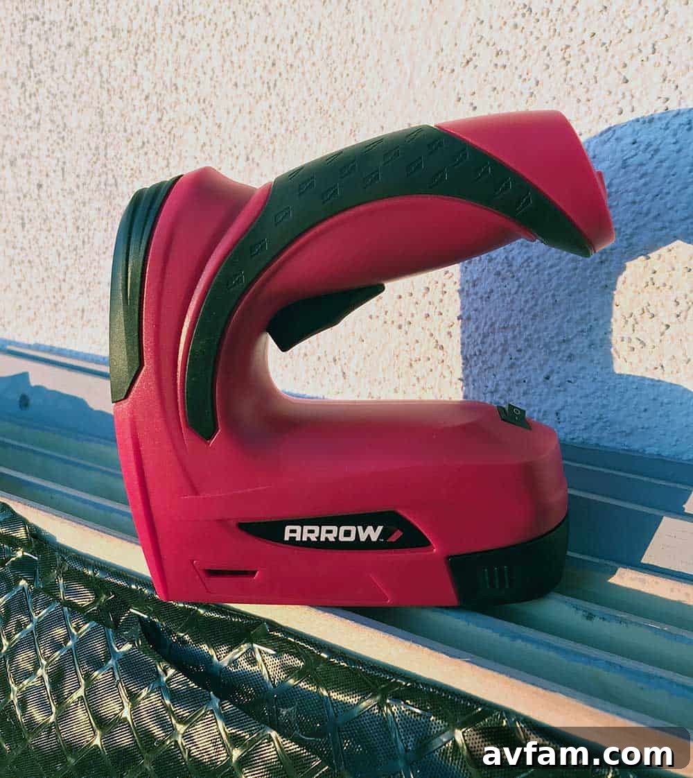 Close-up of stapling roofing paper onto the ramp