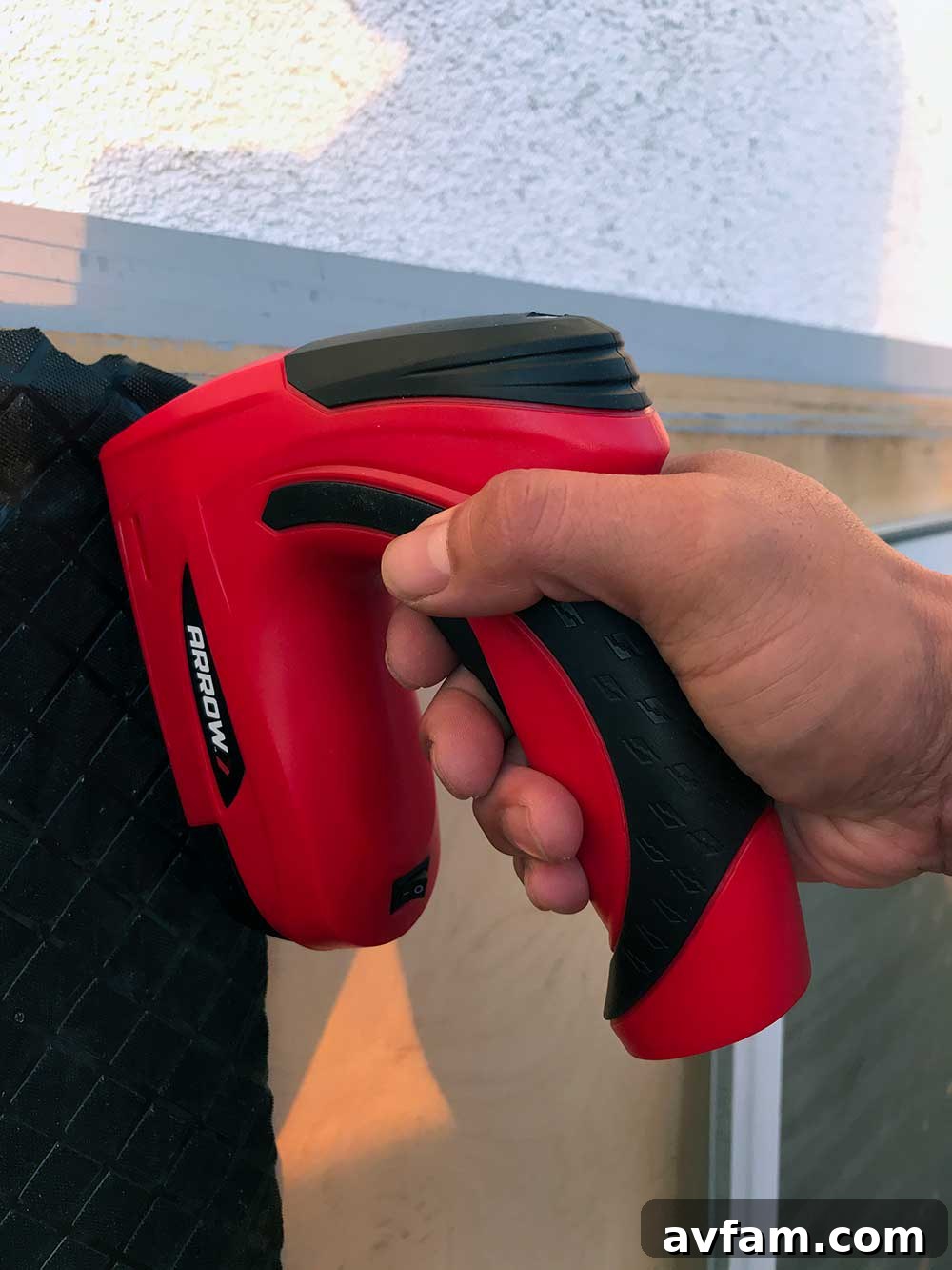 Arrow E21 Cordless Electric Staple Gun in use on the ramp