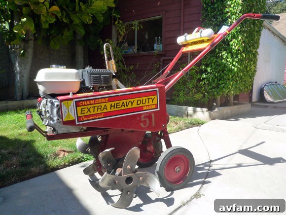 Using a rototiller to prepare the soil rototiller in use on lawn