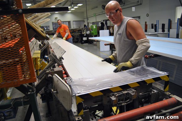 Polyurethane insulation being applied to a garage door panel.