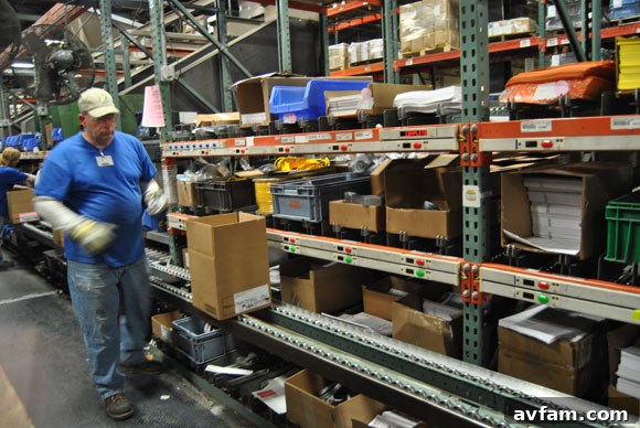 A pick box or container of hardware components for garage doors.