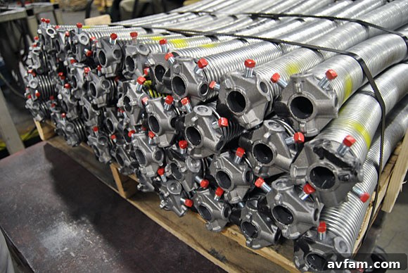 Various garage door springs ready for assembly.