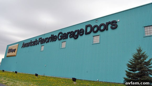 Exterior view of the large teal Clopay manufacturing plant in Troy, Ohio.