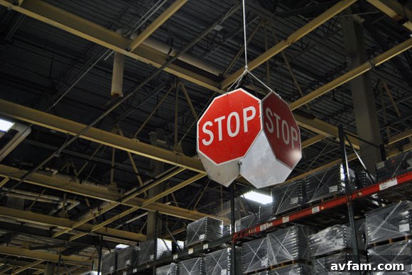A stop sign on the factory floor for safety.