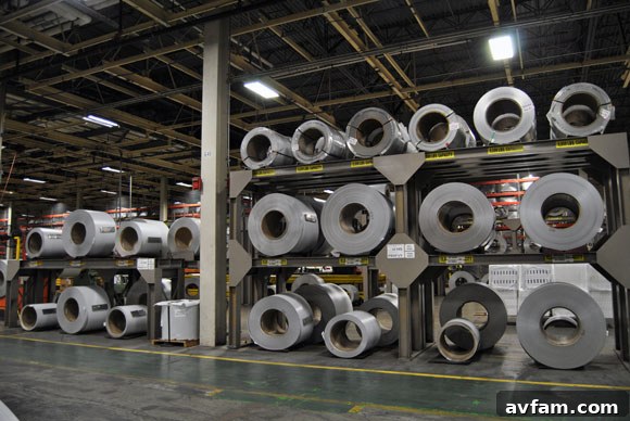 Stack of large steel rolls, raw material for garage doors.