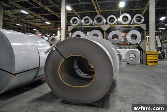 Steel rolls on the ground, indicating material staging.