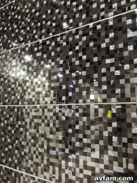 Pixelated black and white graphic tile installation at Coverings