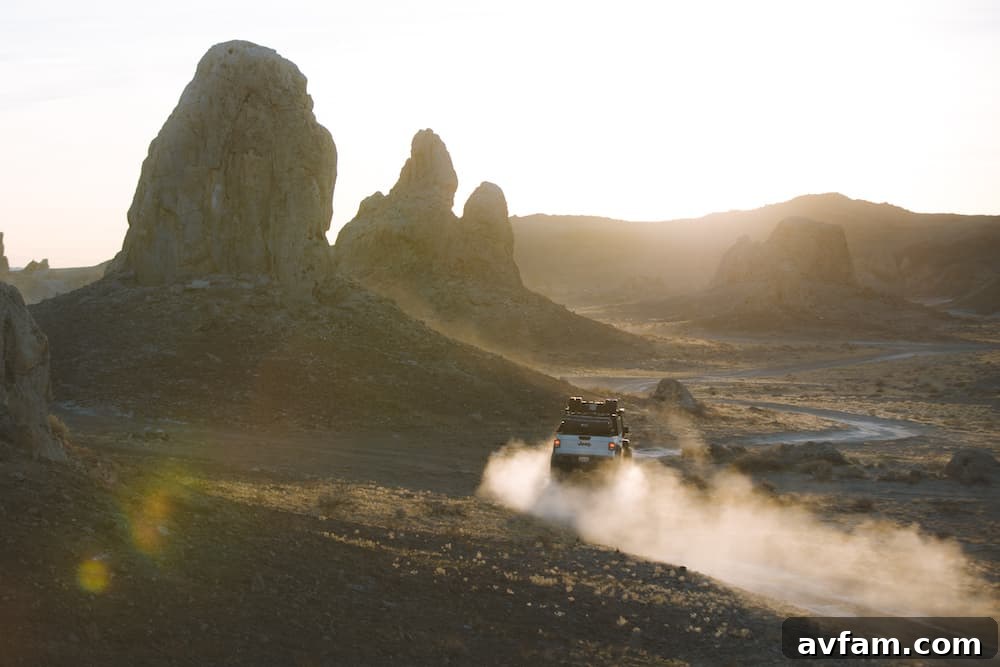 Jeep Gladiator on an off-road trail, showcasing its Front Runner Roof Rack loaded with adventure gear