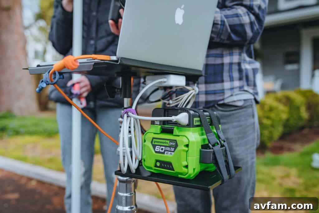 Greenworks 300W Power Inverter connected to a Greenworks 60V battery