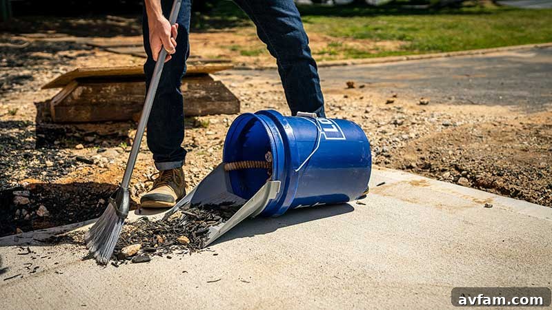 The Quiklid-equipped 5-gallon bucket positioned flat on the ground, showcasing its stable base for effective, non-rolling sweeping.