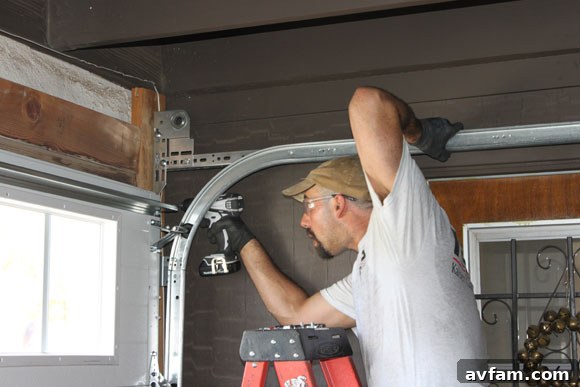 Installer Adjusting New Garage Door Track