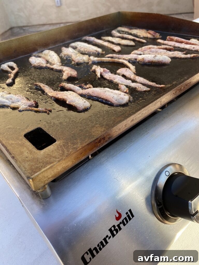 Side view of the Char-Broil 2-Burner Griddle, showing integrated handles.