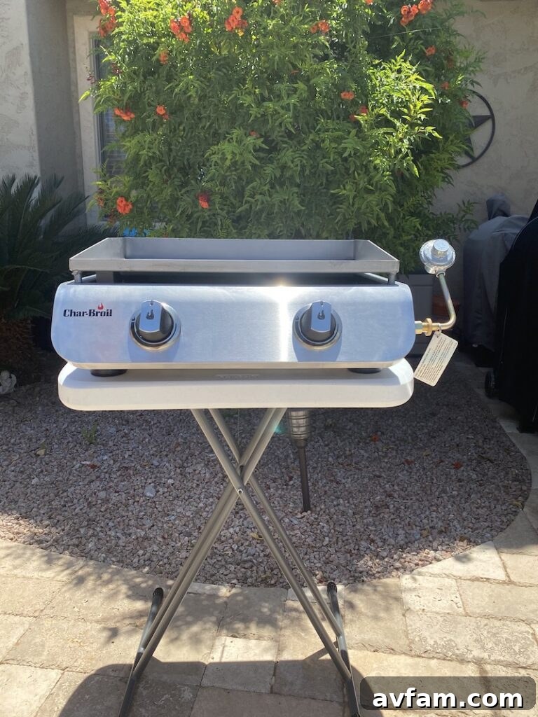 Char-Broil portable griddle with adjustable legs on an uneven surface.