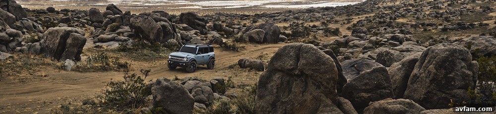 Pre-production 2021 Bronco four-door Badlands series with available Sasquatch off-road package in Cactus Gray with the doors, top and rear quarter windows removed.