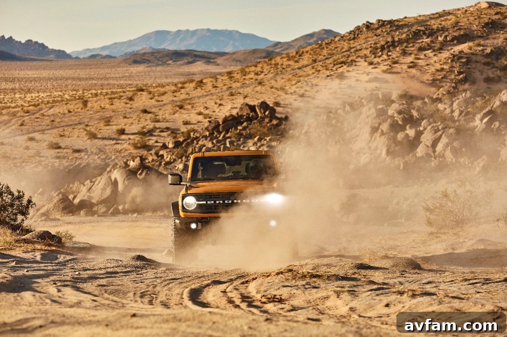 The Ford Bronco ascending a steep, rocky hill, showcasing its climbing ability.