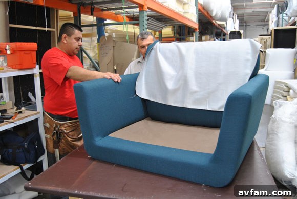 Upholsterer working on a Thrive Furniture piece
