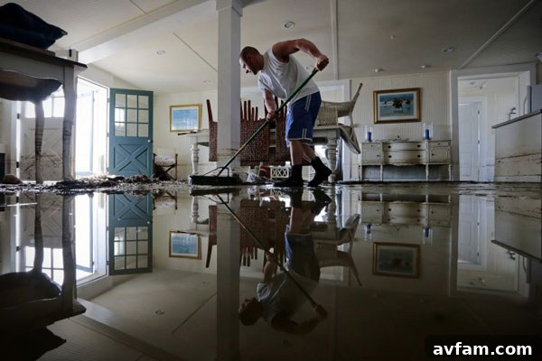 Hurricane Sandy Aftermath: Flooding and Damage Dramatic photo of severe flooding caused by Hurricane Sandy, showing submerged streets and damaged homes.