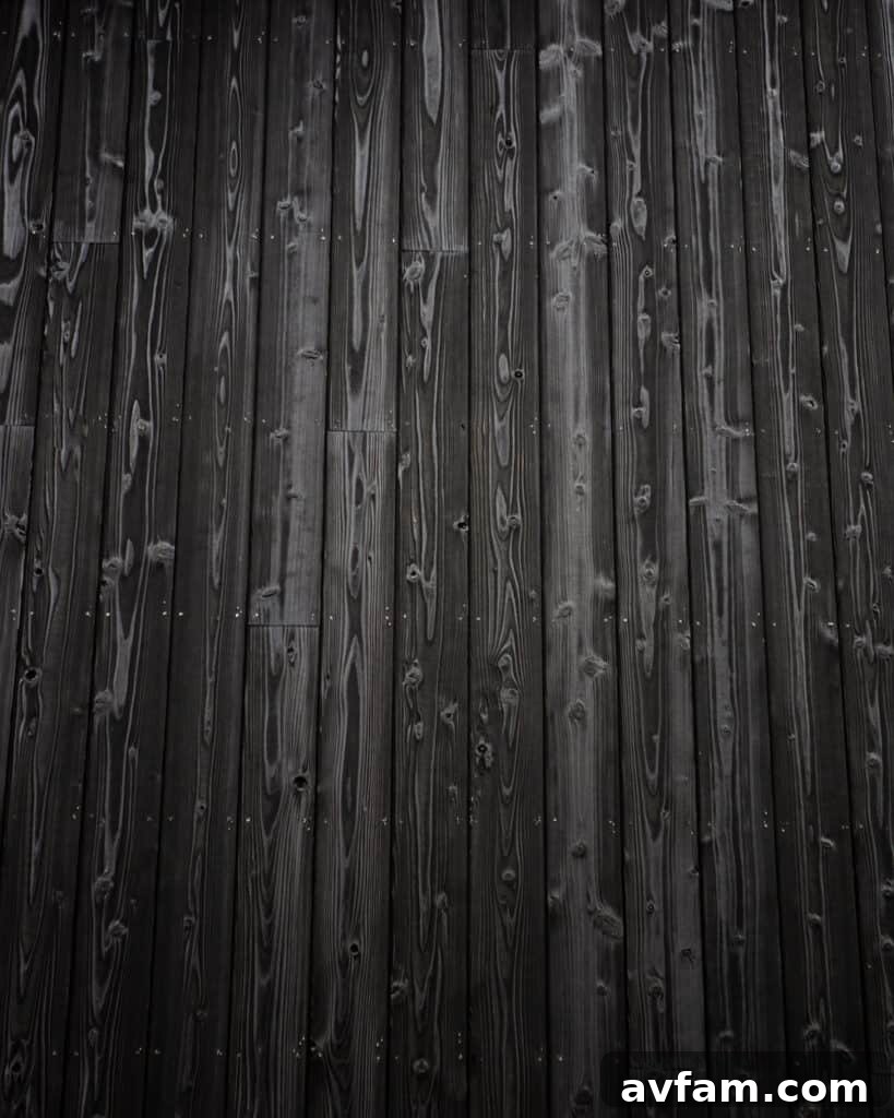 Elegant multi-story building featuring extensive use of charred wood siding.