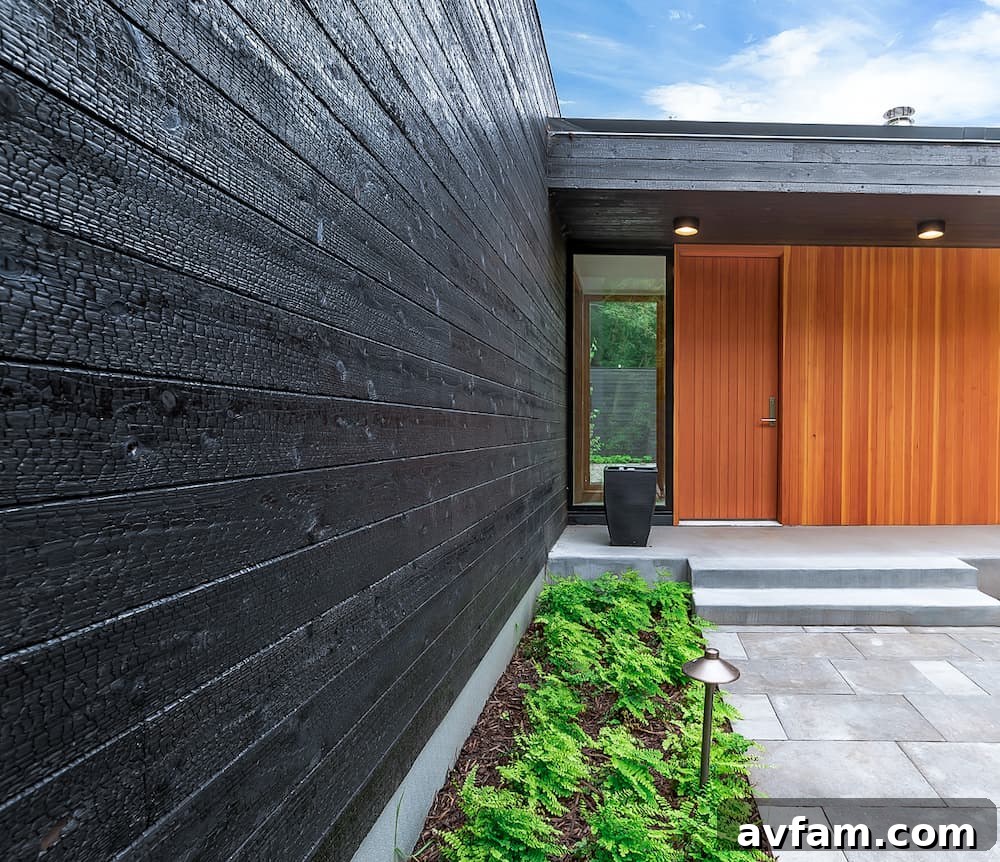 Close-up view of Yakisugi charred wood siding demonstrating its unique texture and dark finish.