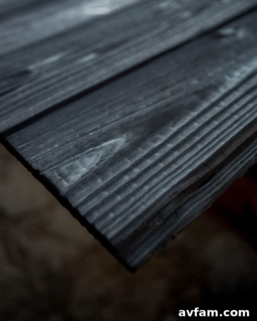 Geometric home design featuring sections of charred wood siding for visual interest.