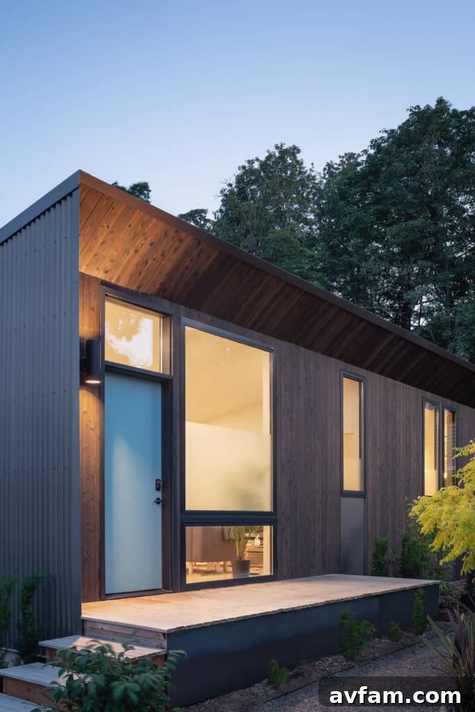 Charred wood siding providing a natural accent to a modern building with a concrete base.
