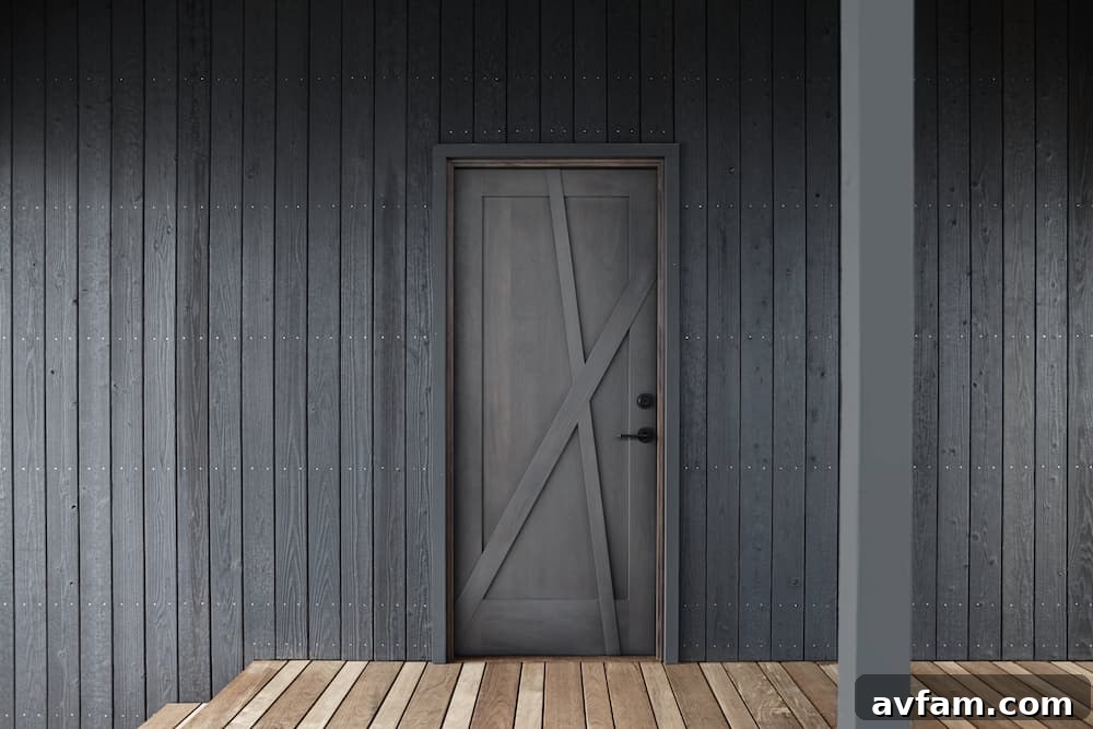 Modern home entrance with a bold statement made by charred wood siding.