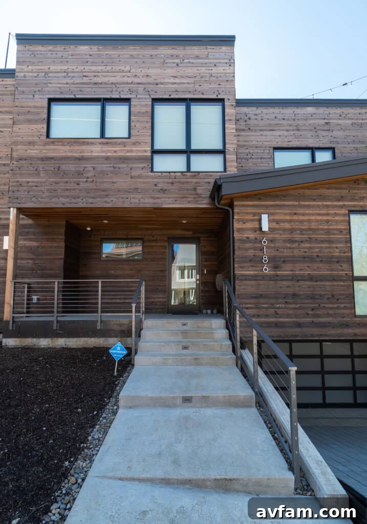 A unique contemporary structure featuring a combination of charred wood and corrugated metal.