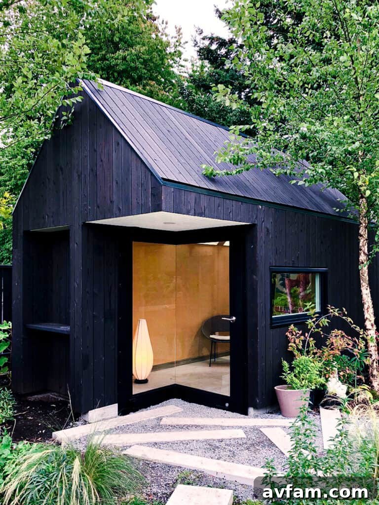 Contemporary building featuring vertical charred wood siding elements and natural light.