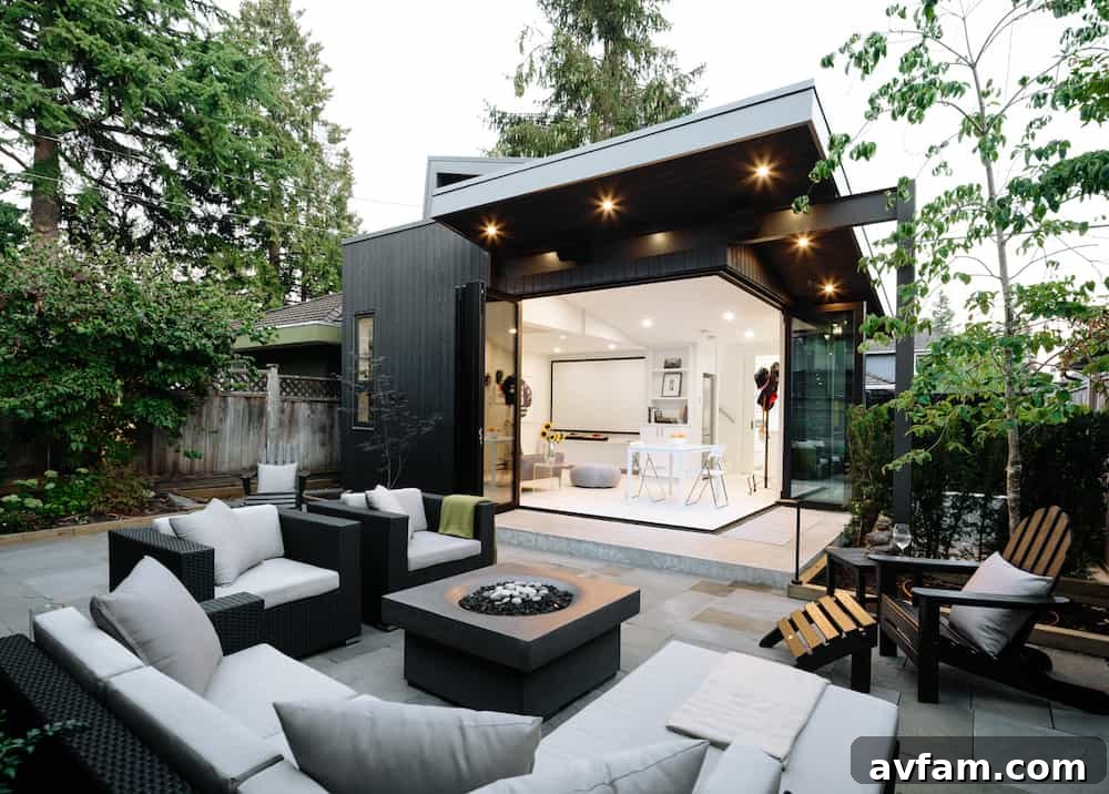 Residential design incorporating charred wood siding with stone and metal accents.